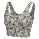 A women's sports bra with a camouflage pattern in shades of brown, beige, gray, and green, shown against a plain white background.