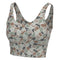 A women's sports bra with a camouflage pattern in shades of brown, beige, gray, and green, shown against a plain white background.