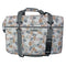 A rectangular duffel bag with a multi-colored camouflage pattern in beige, brown, gray, and white, featuring gray straps and a black buckle closure, shown against a plain white background.
