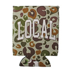A can cooler sleeve featuring a camouflage-style leopard print pattern in olive green, brown, and tan on a light beige background, with the word 'LOCAL' printed across the front in large white block letters.