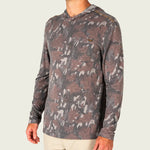Marsh Wear Buxton Tech Hoodie in Lowland Canopy Camo featuring lightweight performance fabric, UPF 40 sun protection, hood, and thumb loops for fishing and outdoor wear.