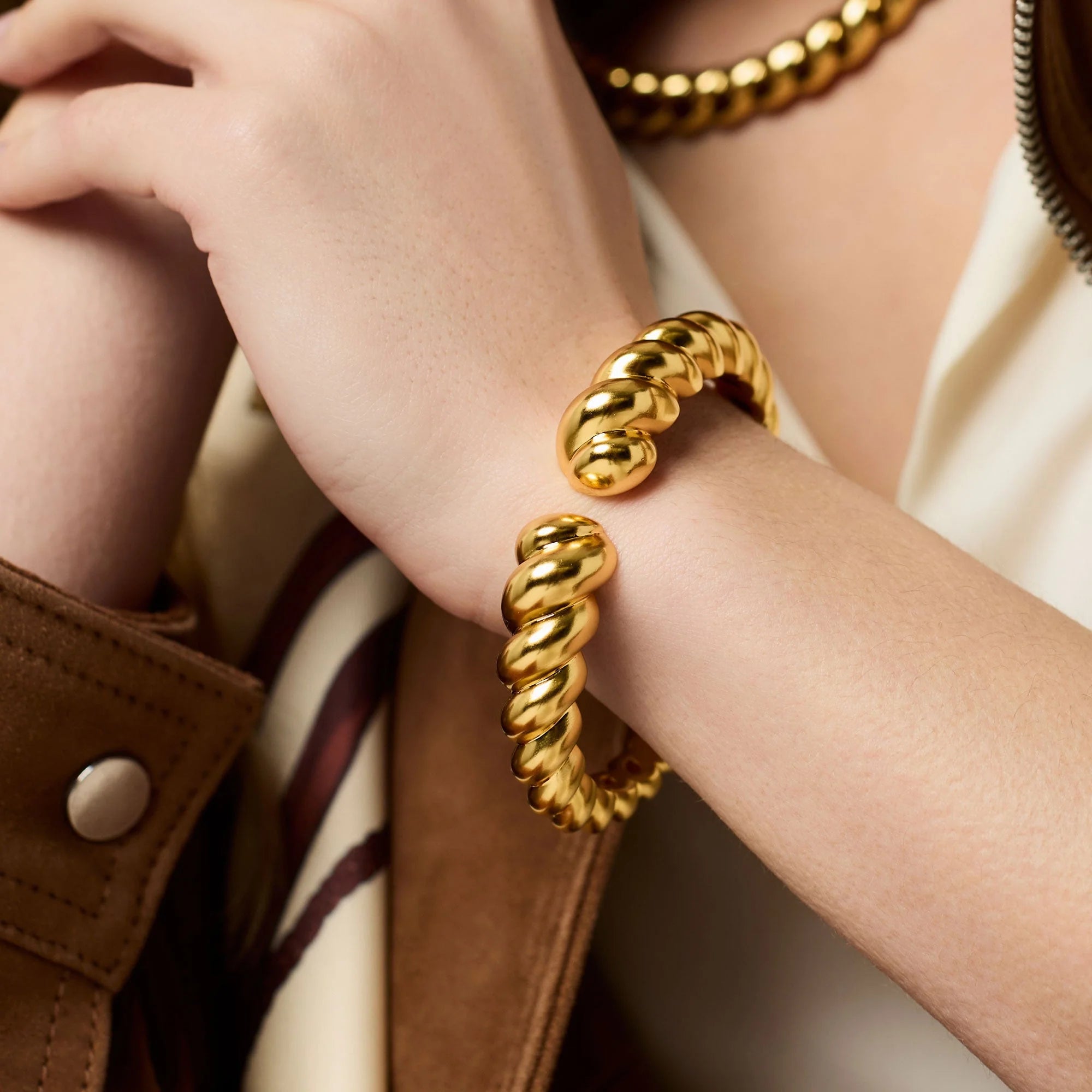 Julie Vos Ravello Cuff in luminous 24K gold plate featuring a bold sculptural silhouette, 0.6-inch width, and spring hinge closure for an elegant statement look.