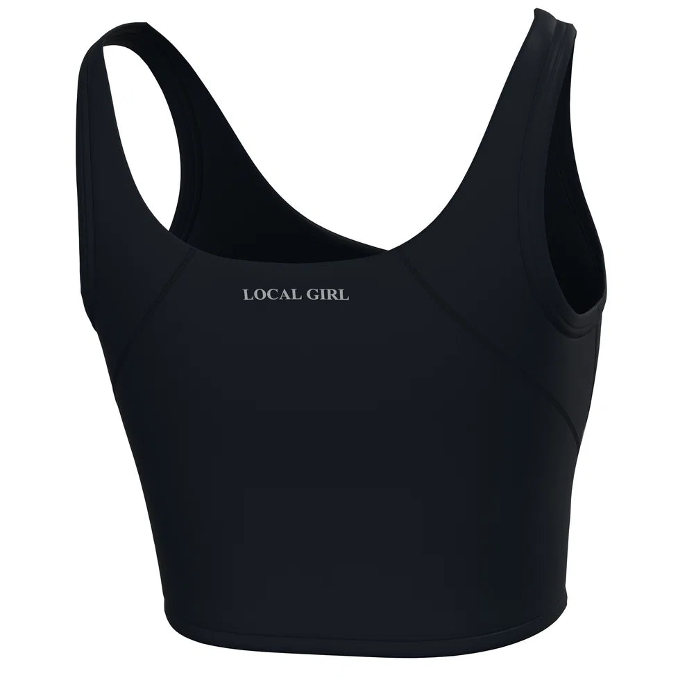 A black athletic sports bra with 'LOCAL GIRL' printed in white text on the chest, shown against a plain white background.