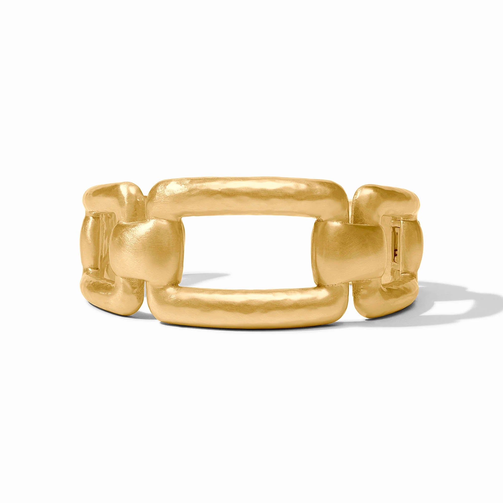 Gold cuff with a white background