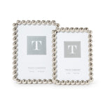 Silver metallic photo frame featuring a sculptural ball-inspired border and glass front, designed for horizontal or vertical display on a tabletop, shelf, desk, or mantel.