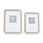 Silver metallic photo frame featuring a sculptural ball-inspired border and glass front, designed for horizontal or vertical display on a tabletop, shelf, desk, or mantel.