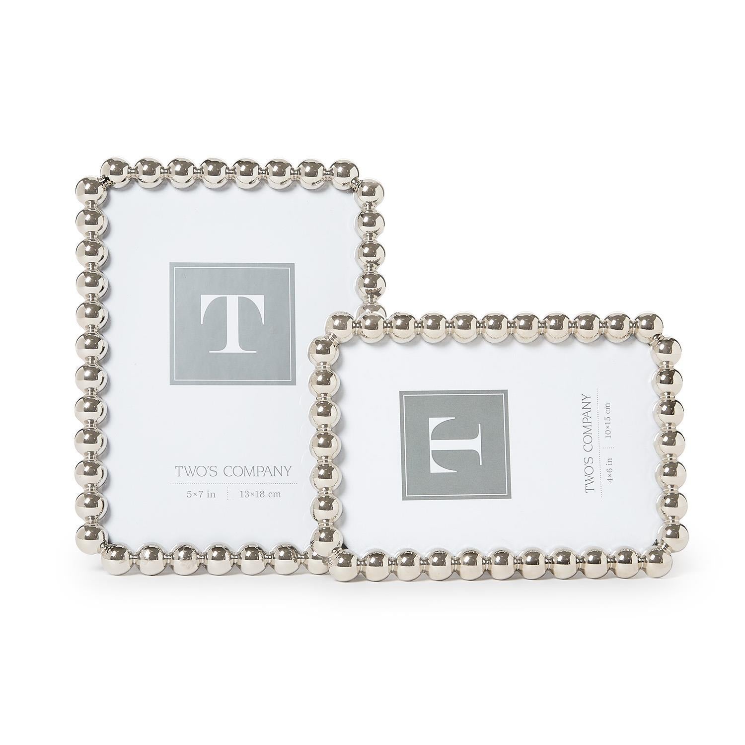 Silver metallic photo frame featuring a sculptural ball-inspired border and glass front, designed for horizontal or vertical display on a tabletop, shelf, desk, or mantel.