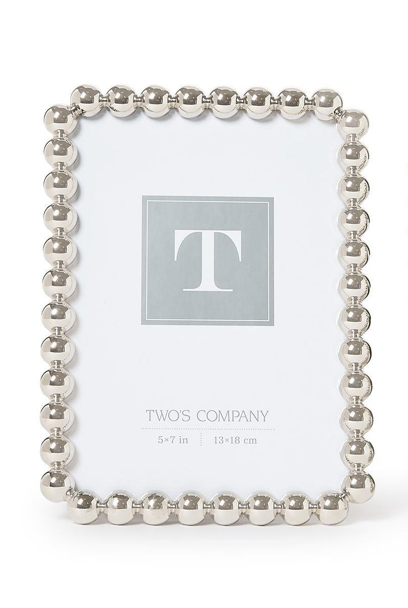 5x7 Silver metallic photo frame featuring a sculptural ball-inspired border and glass front, designed for horizontal or vertical display on a tabletop, shelf, desk, or mantel.