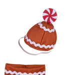 A gingerbread-themed costume accessory set featuring a brown knit hat with white icing-like trim and a red-and-white peppermint candy on top, plus a matching brown headband with white trim, shown on a plain white background.