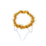 A gold metallic tinsel headband styled like a treetop crown, displayed on a white plastic stand against a solid white background.