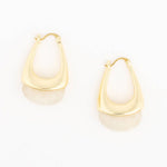 A pair of gold crescent-shaped hoop earrings with a polished finish, displayed on a clean white background with soft reflections below.
