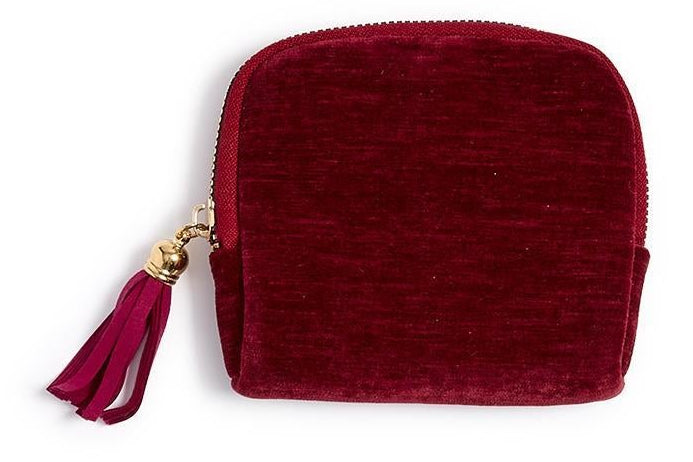Three small zip-up pouches in red, green, and blue with tassels on a white background
