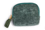 Three small zip-up pouches in red, green, and blue with tassels on a white background