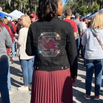 Officially licensed NCAA USC Spurs Up Gamecock denim jacket featuring University of South Carolina detailing in a classic button-front game-day style.