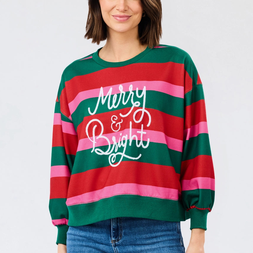 Mary Square Millie Merry & Bright Sweatshirt featuring bold red, green, and pink stripes with white Merry & Bright script across the front.