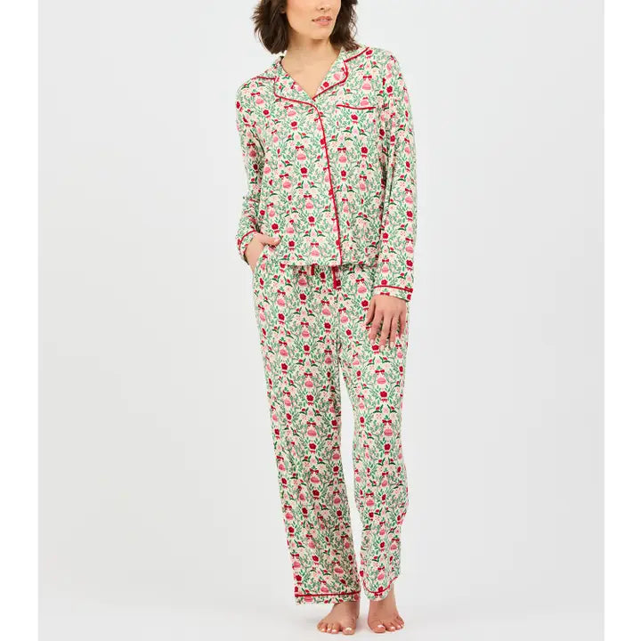 Mary Square Trimmed with Joy Pajama Set featuring a festive pink, red, and green Christmas print with a button-front top, red piping, and coordinating full-length pants.