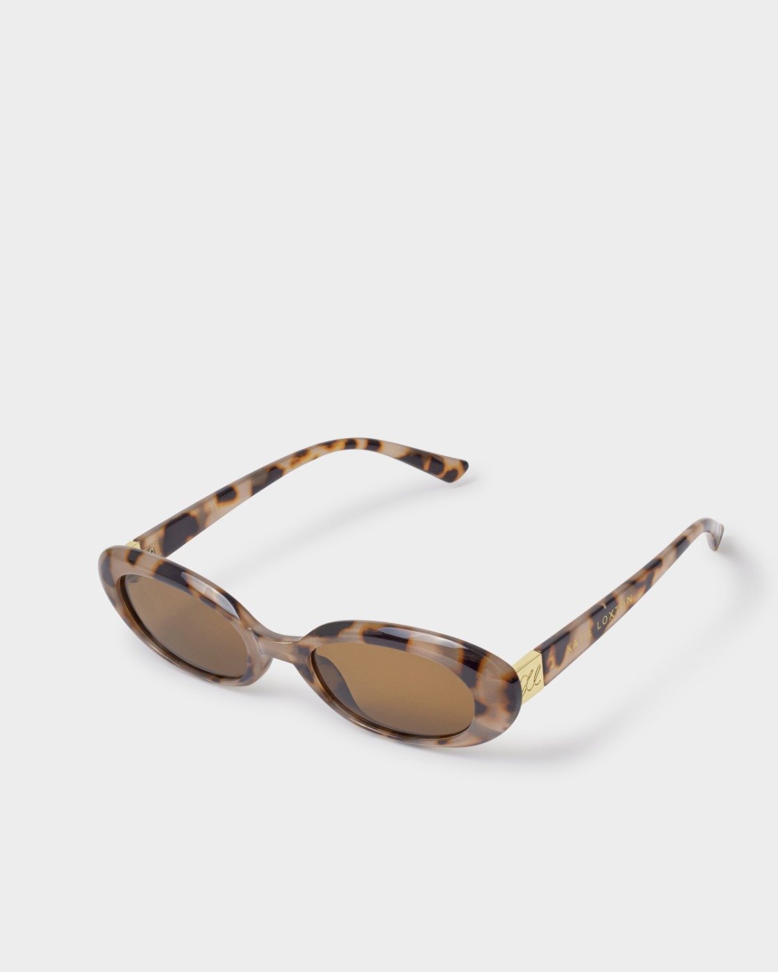 Sunglasses with tortoiseshell frame and brown lenses on a white background