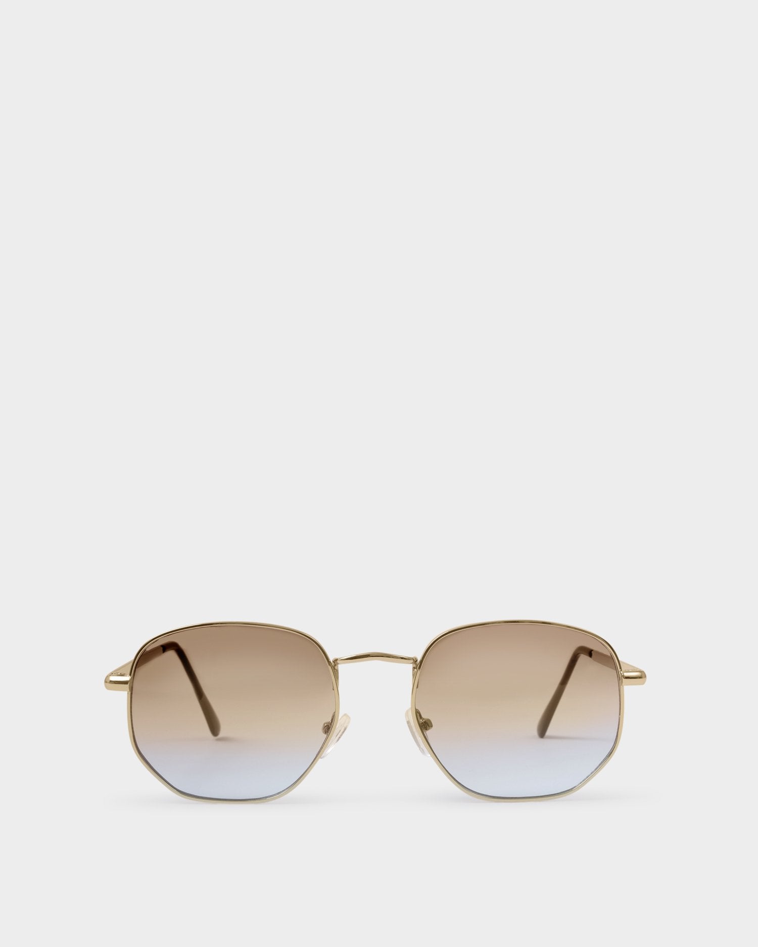 Sunglasses with gradient lenses on a white background